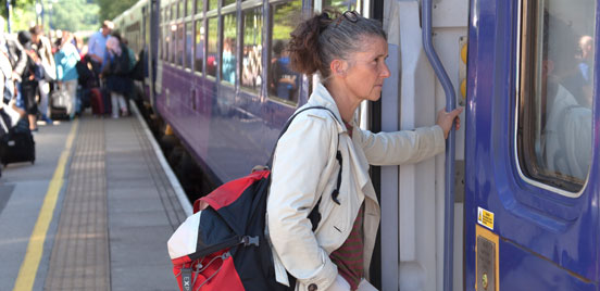 Woman boarding train