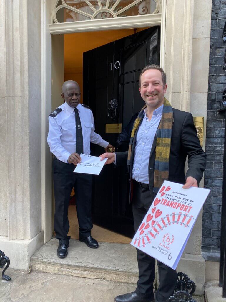 Michael Solomon Williams from Campaign for Better Transport handing in a Valentine's Card and letter to Downing St
