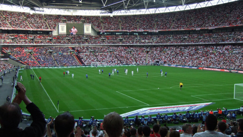 Image of football stadium with football match in progress