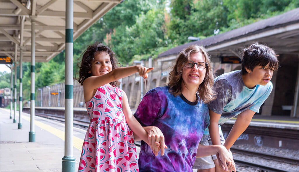 Photo: a young family waits for the train