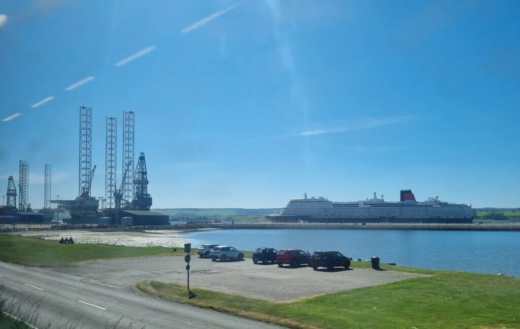 View of cruise ship in the port with blue sky along the Far North Line