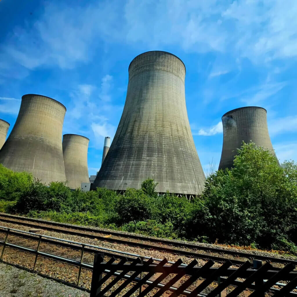 View of power station cooling towers from the train