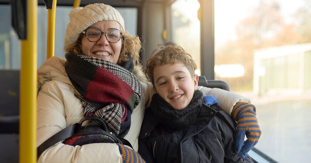 Photo of woman and boy on bus