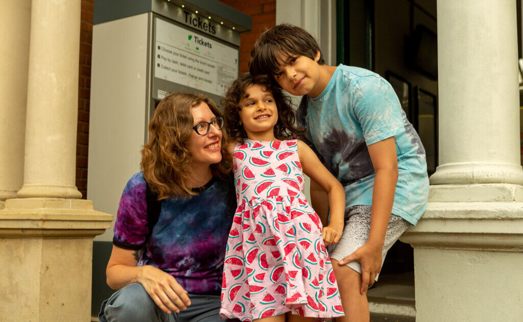 Photo: family by train ticket machine